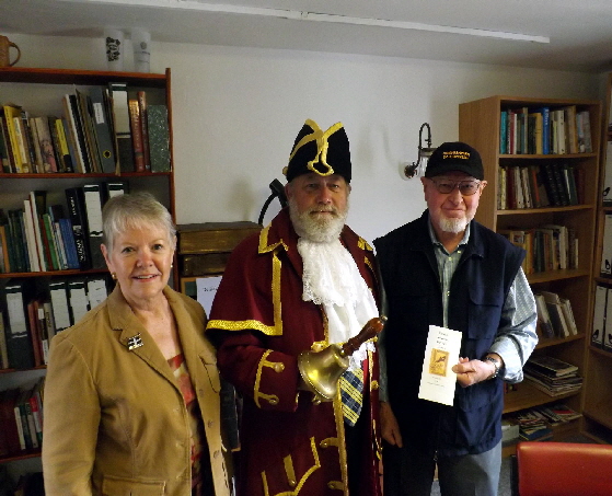 USA visitors talking to Redruth Town Crier (George Saint) in our offices.